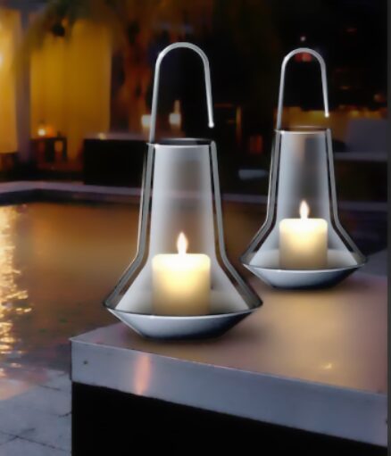 Handcrafted candle lanterns glowing at dusk